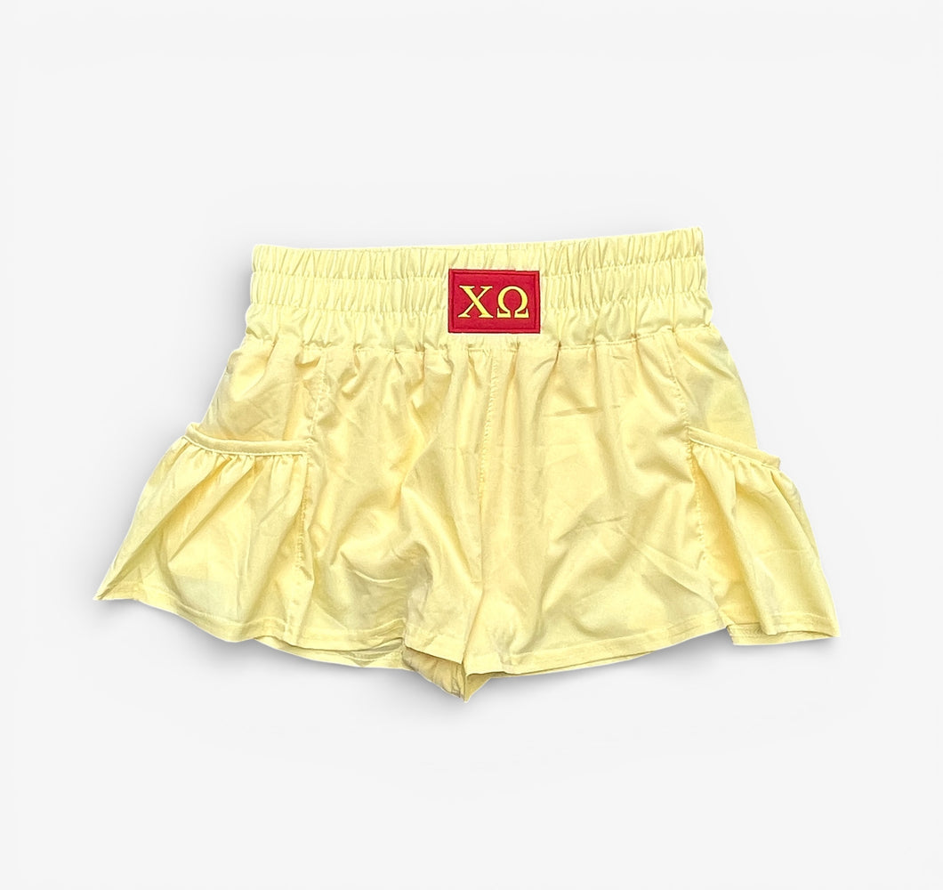 Chi Omega Patch Yellow Flounce Shorts